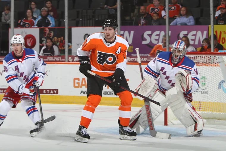 Flyers winger Noah Cates sets up in front of the net during a rookie game against the New York Rangers on Friday.