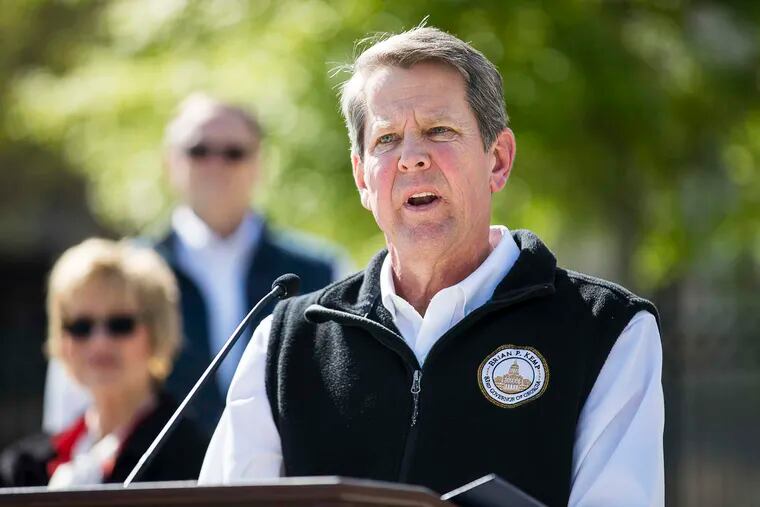 FILE - In this Wednesday, April 1, 2020 file photo, Georgia Gov. Brian Kemp speaks during a news conference at Liberty Plaza across the street from the Georgia state Capitol building in downtown Atlanta. Kemp is in a very public battle with Shirley Sessions, who was sworn in barely three months ago as mayor of Tybee Island, a small coastal community that thrives on beach tourism, after he reversed the city's painful decision to close its own beach to slow the coronavirus.