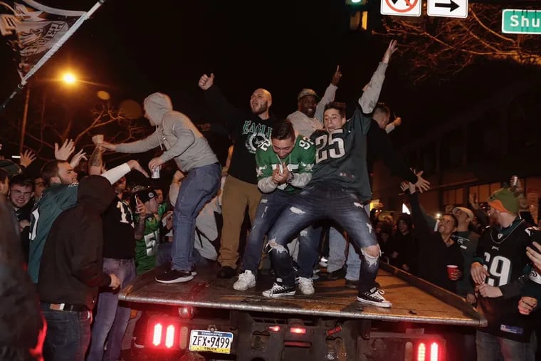 Eagles fans celebrate on south Broad Street near Shunk after their team defeated the Vikings in the NFC Championship game Sunday January 21, 2018. 