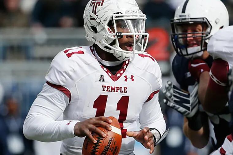 Temple quarterback P.J. Walker (11) looks to pass during the first quarter of an NCAA college football game against Penn State in State College, Pa., Saturday, Nov. 15, 2014. (Gene J. Puskar/AP)