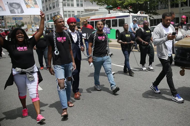 Ryshee Shaw, 13, second from left, marches with other activists down North Broad Street toward City Hall in Philadelphia as they rally against gun violence and other issues on Tuesday, May 21, 2019. The "Rise Up Break the Chains Youth March," organized by Ryshee, went down Broad Street from York to City Hall on election day to bring attention to bullying, gun violence, mass incarceration, mental health, substance abuse, racial profiling, and youth homelessness.
