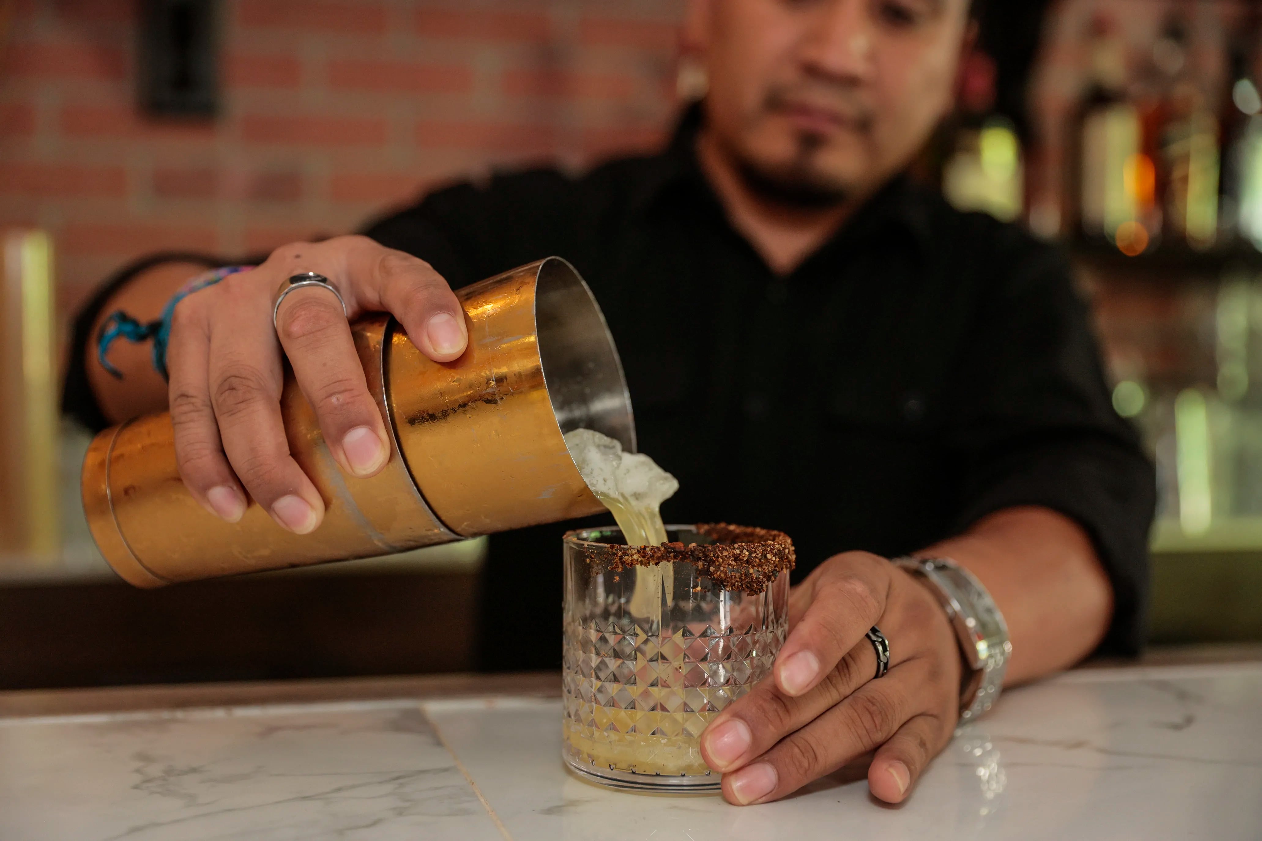 El Mezcal Cantina bartender Chino making drinks a Al Pastor.Thursday September 1, 2022.