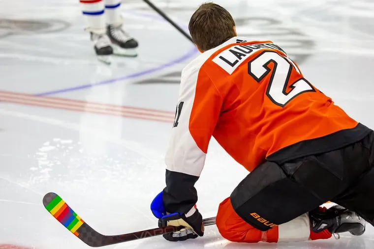 Flyers' Scott Laughton, pictured before the Pride Night game this season against the Canadiens, is involved with several LGBTQ+ organizations and an ally to the community.