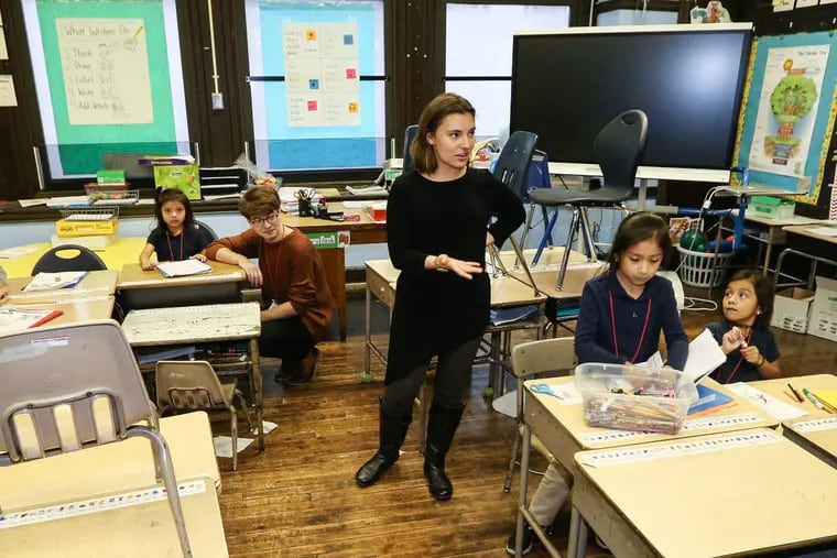 Program coordinator Alexandra Wolkoff talks to a first grade class at the Southwark Elementary School, where Puentes de Salud, a health clinic for immigrants, has branched out with an after-school  program for  students.