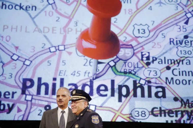 Attorney General Eric Holder, left, poses for a photograph with Philadelphia Police Commissioner Charles Ramsey, during the Annual International Association of Chiefs of Police Conference, Monday, Oct. 21, 2013, at the Pennsylvania Convention Center. (Associated Press)