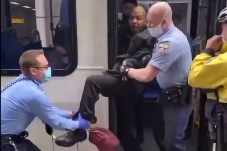 Screen still of a man being removed from a SEPTA bus. The video prompted confusion about whether people had to wear face masks on SEPTA transit during the coronavirus pandemic.  The video was posted on the Twitter account of the Philly Transit Riders Union.