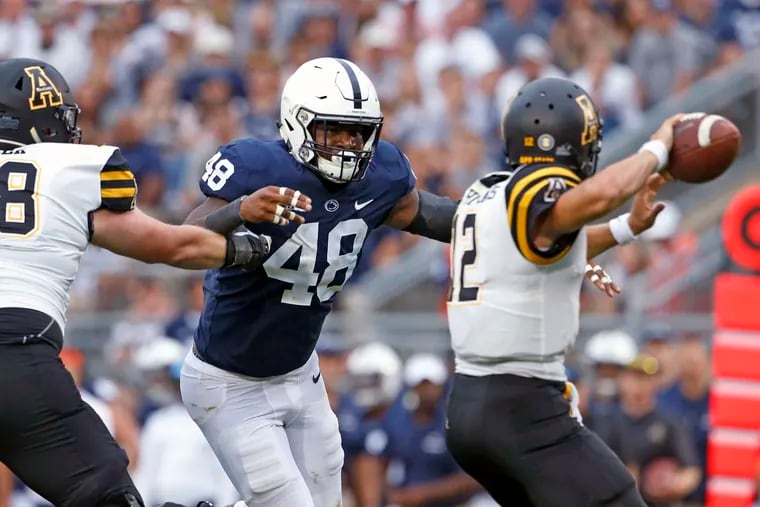 Penn State's Shareef Miller (48) goiing after Appalachian State quarterback Zac Thomas (12) during the second half Saturday.