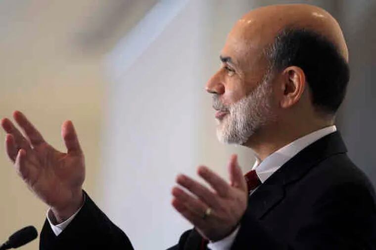 Federal Reserve Chairman Ben S. Bernanke speaking at a Fed conference in Chatham, Mass., yesterday. Among his points, Bernanke said that legislators should ensure that the cost of closing large, failing financial institutions is borne by the industry instead of taxpayers.