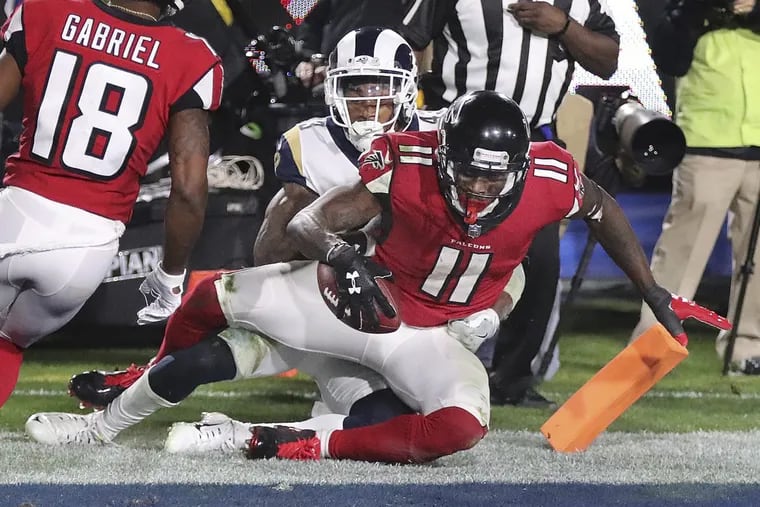 Atlanta wide receiver Julio Jones catches a touchdown pass against the Rams during Saturday’s upset win at Los Angeles.  (Curtis Compton/Atlanta Journal-Constitution via AP)