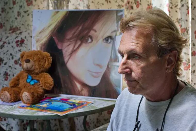 Andy Rumford and a photo of his daughter from 2012 at age 22.  Kacie died of a heroin overdose this past March.   ( DAVID M WARREN / Staff Photographer )