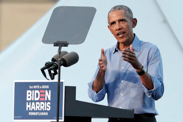 Former President Barak Obama speaks from the podium during a drive-in rally for Joe Biden outside of Citizens Bank Park in South Phila. on October 21, 2020.
