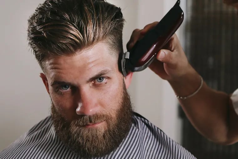 Bryce Harper during a photo shoot at a Blind Barber haircut-and-drinking salon.