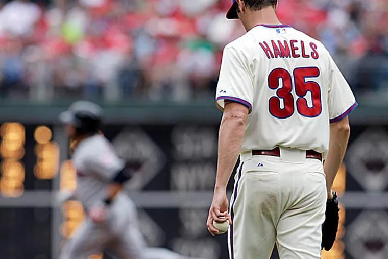Cole Hamels deserved as much if not more of the blame for this failed effort. (H. Rumph Jr/AP)