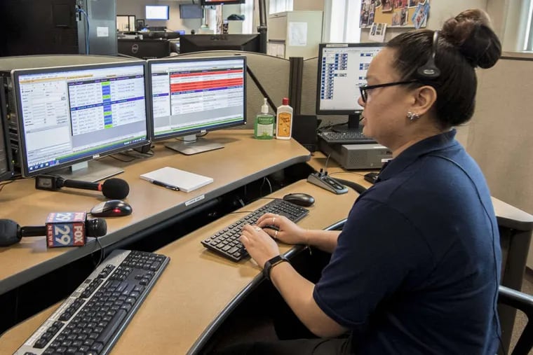 Jasmine Zulawski, public safety dispatcher with the NJ State Police Dispatch Center, demonstrates the state’s #77 phone system for receiving calls about distracted drivers.
