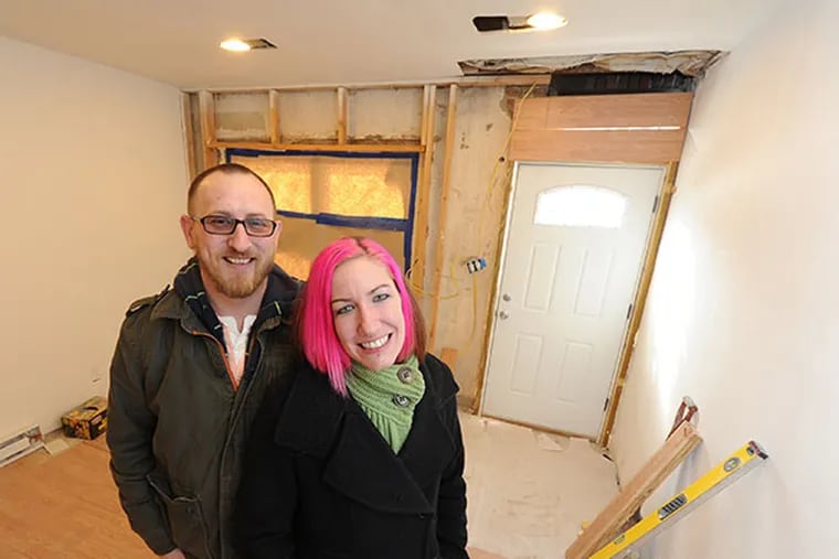 Lisa Sipes (right), and Rusty Doll, both with the group Change Philly Today, are in the house the organization bought and will be renovating for use as a safe house for LGBT teens, in North Philadelphia.  ( CLEM MURRAY / Staff Photographer )