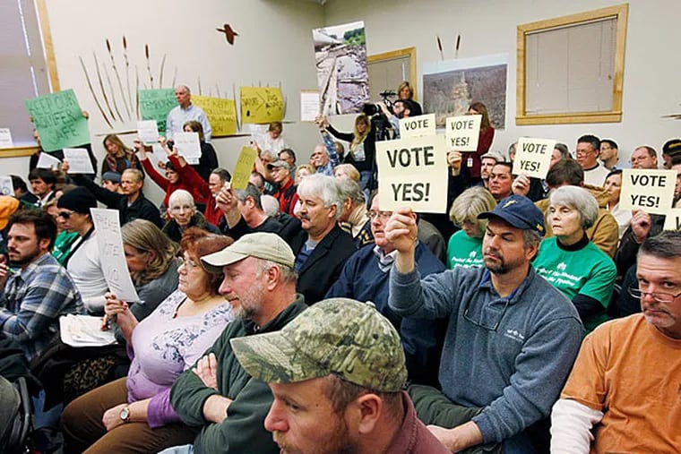 Supporters and opponents of a 22-mile gas pipeline attend a Jan. 10, 2014, meeting of the New Jersey Pinelands Commission.
