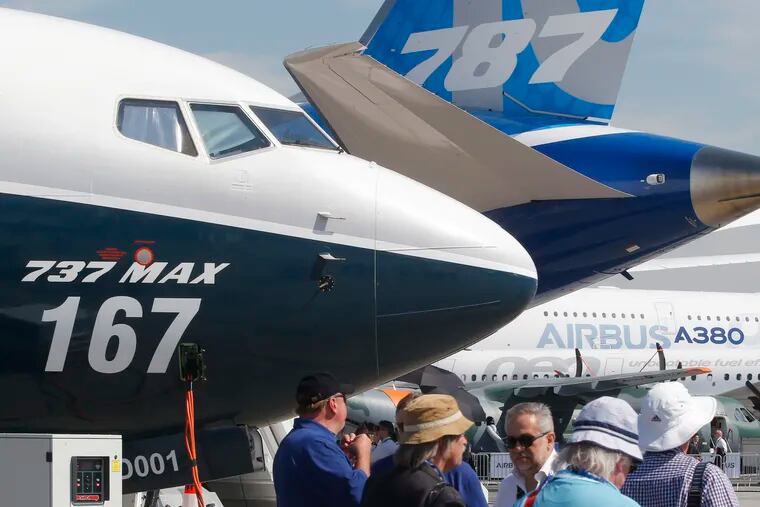 FILE - In this June 20, 2017, file photo Boeing planes displayed at Paris Air Show, in Le Bourget, east of Paris, France. Uncertainty over a Boeing jet and apprehension about the global economy hover over the aircraft industry as it prepares for next week's Paris Air Show. (AP Photo/Michel Euler, File)