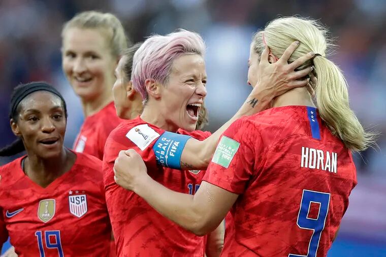 United States' scorer Lindsey Horan, right, celebrates their side's 3rd goal with Megan Rapinoe during the Women's World Cup Group F soccer match between United States and Thailand at the Stade Auguste-Delaune in Reims, France on June 11.