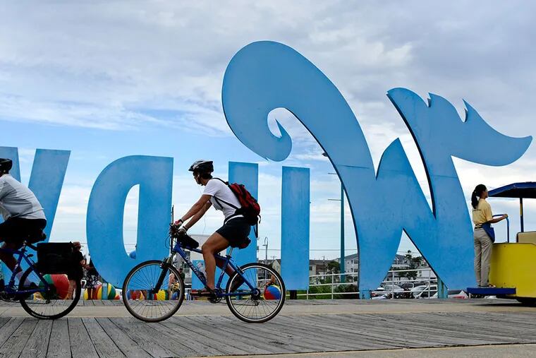 Biking on the Boardwalk in Wildwood,  where a scenic bike route runs nearly the entire length of the 5-mile island, beginning in Wildwood Crest. ( TOM GRALISH / Staff Photographer )