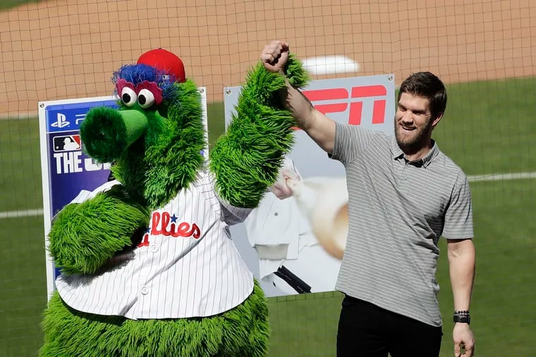 Bryce Harper became fast friends with the Phanatic at his introductory news conference with the Phillies in 2019.
