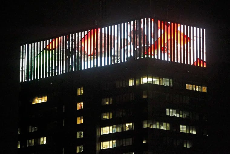 A light art display atop PECO's crown lights on Sept. 16, 2011.  (Akira Suwa / Staff Photographer )