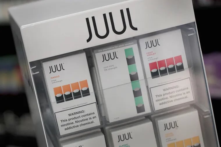 Electronic cigarettes and pods by Juul, the nation's largest maker of vaping products, are offered for sale.