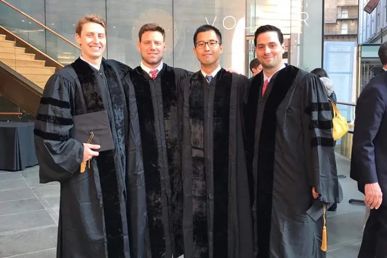 From left, Ryan Carey, Alex Fairman, Jason Han and Alex Sotolongo celebrate their recent graduation from the Perelman School of Medicine at the University of Pennsylvania.