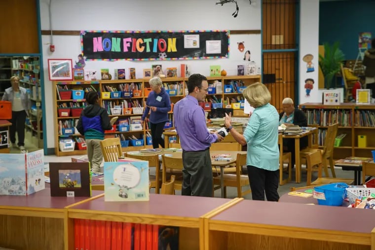 Teachers and students use the library at the John B. Kelly School, a library that Penny Colgan-Davis, a longtime Philly educator and administrator, worked to reopen herself.