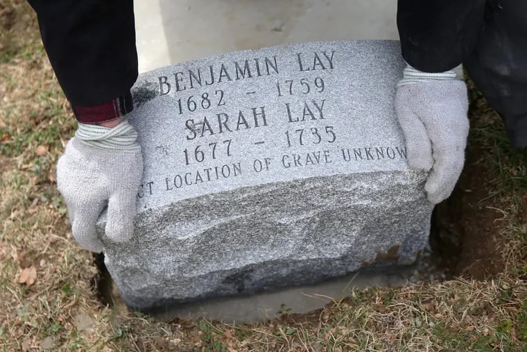 Caretaker Dave Wermeling installs a new headstone for Quaker abolitionist Benjamin Lay and his wife, Sarah, at Abington Friends Meeting burial ground.