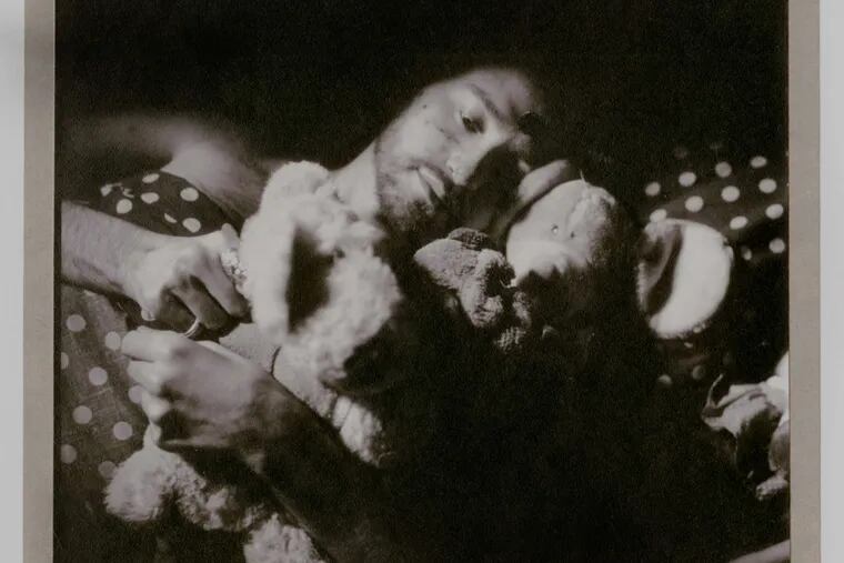 Bruce Cratsley's photograph &quot;David in Bed with his 'Animal Friends,' &quot; an undated gelatin silver print, is part of the &quot;Bruce Cratsley: Shifting Identities&quot; exhibition at Swarthmore College's List Gallery. Cratsley graduated from Swarthmore in 1966.