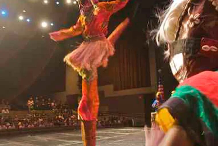 To celebrate Campbell's funding groups for another summer, Pasha the Stiltwalker performs with the Universal African Dance and Drum Ensemble at Gordon Theater in Camden.