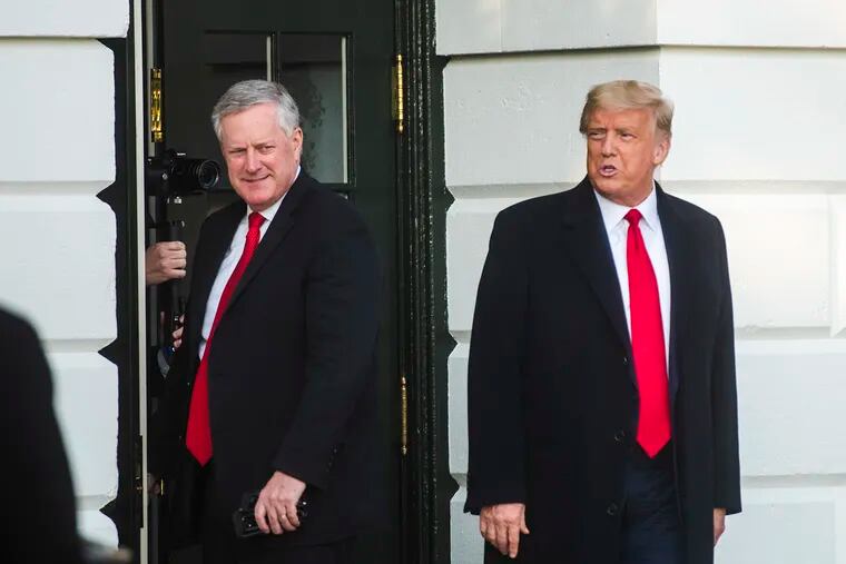 White House Chief of Staff Mark Meadows (left) accompanies President Trump as he departs the White House en route to a rally in North Carolina last week.