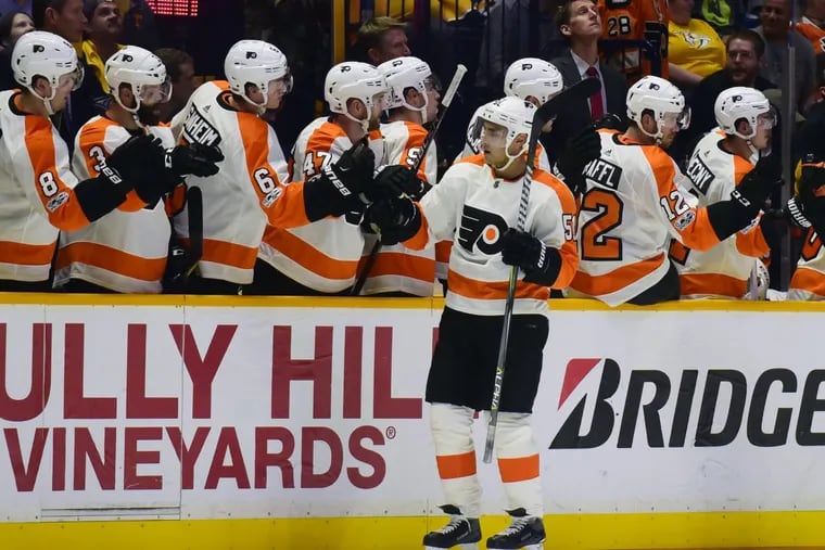 Val Filppula is congratulated after scoring one of his two power-play goals against Nashville on Tuesday.