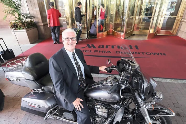 Robert Allen, GM of the Philadelphia Marriott, the state's largest hotel. Allen with his Harley, Wednesday, September 17, 2014. (Steven M. Falk/Staff Photographer)