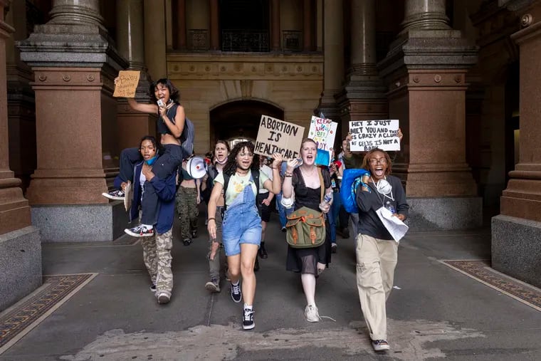Abortion rights protesters march through Philadelphia City Hall on May 25. City officials on Thursday announced a $500,000 donation to the Abortion Liberation Fund of PA, which provides financial assistance to those seeking abortion care in Southeastern Pennsylvania.