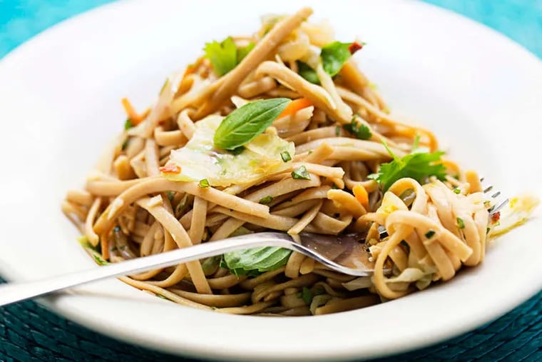 Basil-cilantro noodles make for a light meal on a warm summer night. ( SCOTT SUCHMAN / Washington Post )