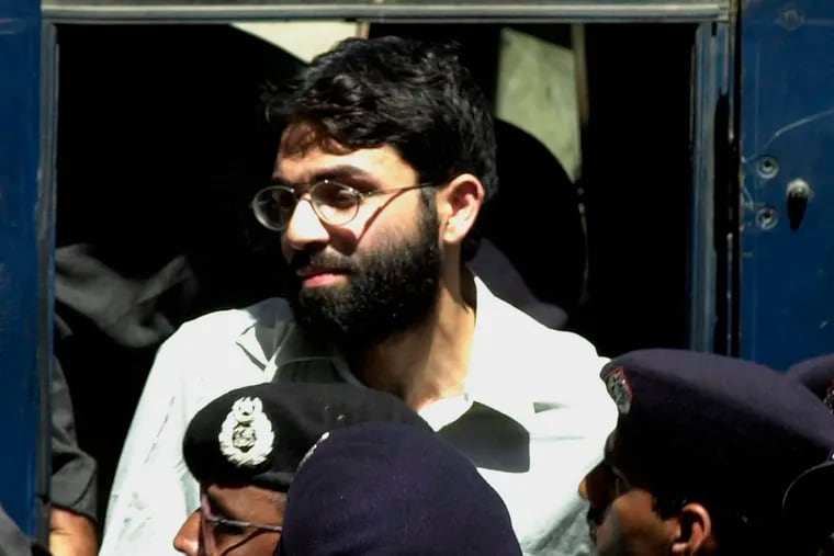 Ahmed Omar Saeed Sheikh, the alleged mastermind behind Wall Street Journal reporter Daniel Pearl's kidnap-slaying, appears at the court in Karachi, Pakistan, in March 2002.