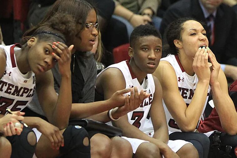 Dejection begins to show on the faces of Temple players as Connecticut pulls away late in the first half. (Charles Fox/Staff Photographer)