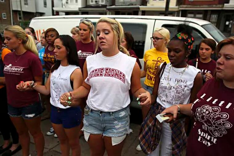 Fellow students and teachers from Little Flower High School participate in a candlelight vigil for 17-year-old Jaylin Landaverry on Wednesday July 23, 2014, at the scene of the food truck explosion on Wyoming Avenue in the Feltonville section. Landaverry died Tuesday night at Temple University Hospital from the injuries she suffered during a July 1, 2014, food truck explosion.  For the Daily News/ Joseph Kaczmarek