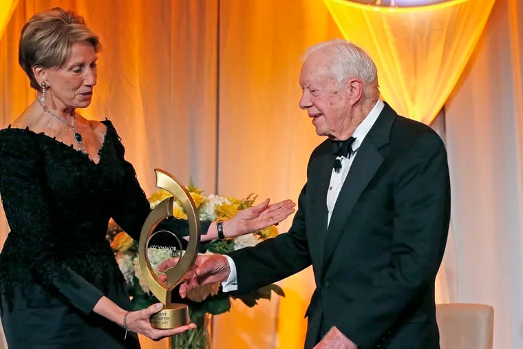 FILE - In this Jan. 27, 2017, file photo, former President Jimmy Carter accepts the O'Connor Justice Prize from former U.S. Ambassador to Finland Barbara Barrett at the Sandra Day O'Connor College of Law at Arizona State University Justice Prize Dinner in Phoenix. President Donald Trump has nominated Barrett to be the next secretary of the Air Force.