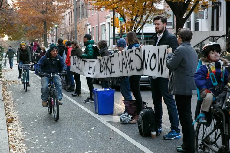 Protesters advocate for safer bike lanes by lining up at 11th and Spruce Streets on Wednesday. A cyclist’s death has spurred debate about how Philadelphia could be safer for cyclists.