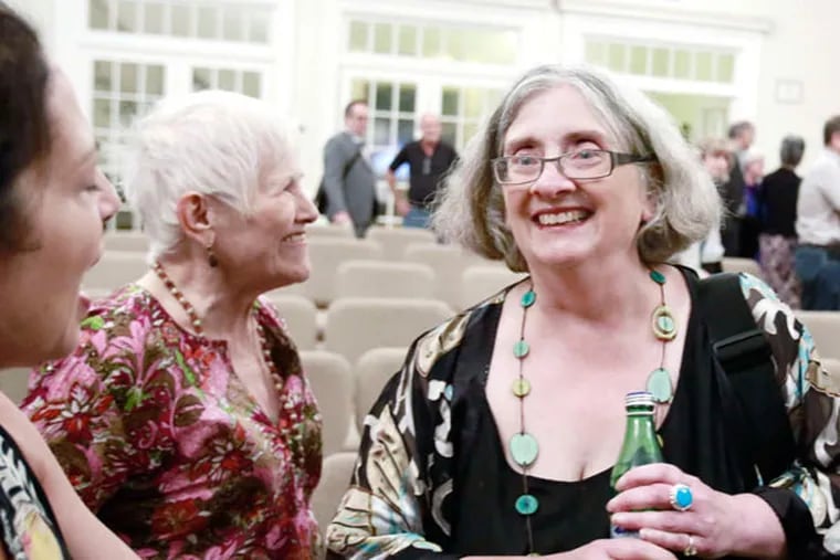 Sue Russell (right) is greeted by friends after her cabaret performance at the Ethical Society on Rittenhouse Square in July. "Going last is a slot of honor. And afterward, the audience applauds and hoots. I imagine my far-flung cancer family clapping too as I take my bows."