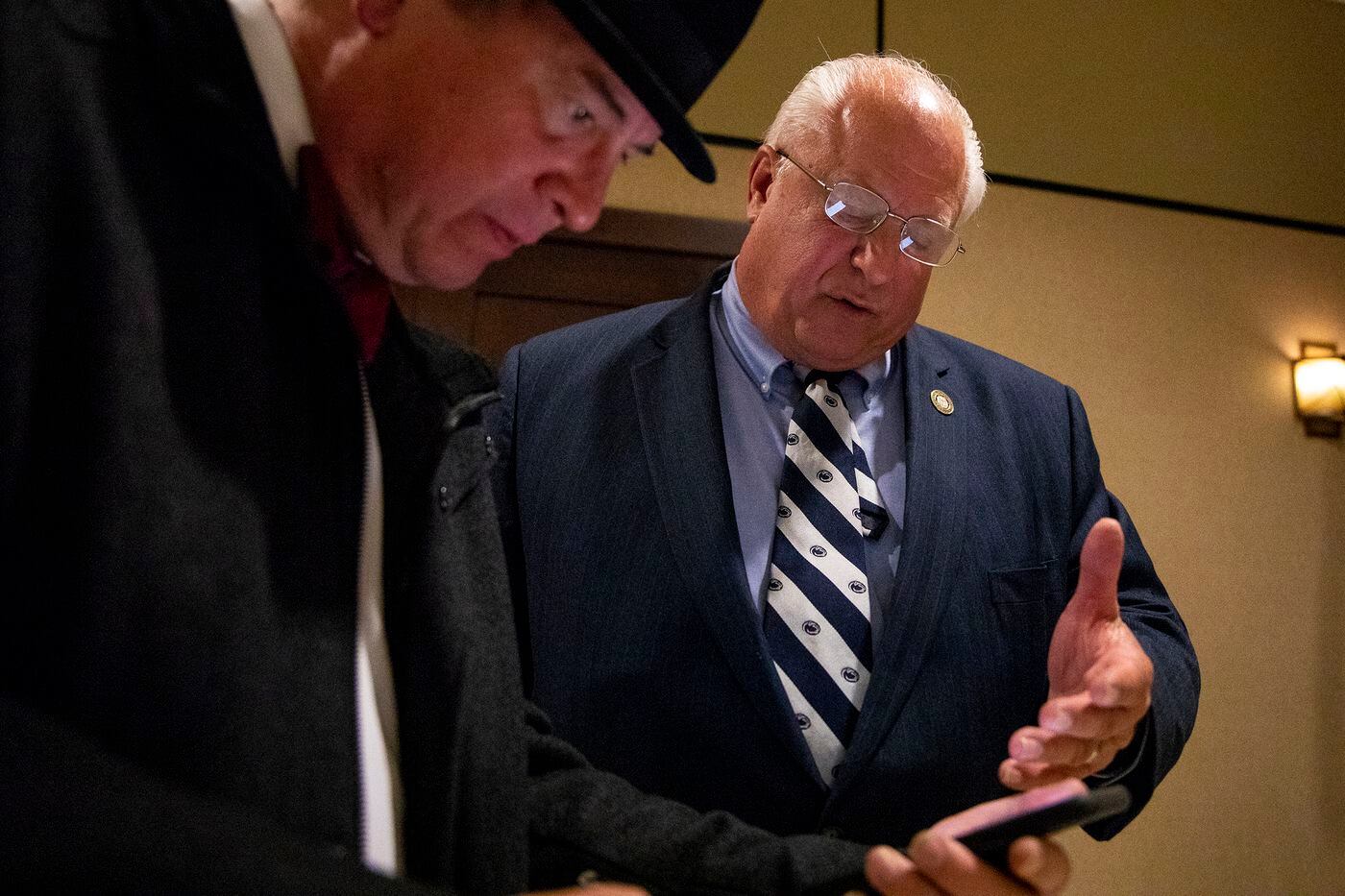 Councilman Al Taubenberger, 66, of Fox Chase, Philadelphia, Republican Candidate for Philadelphia City Council, looks over earlier results with Mike Bobby, 54, of Fox Chase, at the watch party at the FOP Lodge 5, on Tuesday.