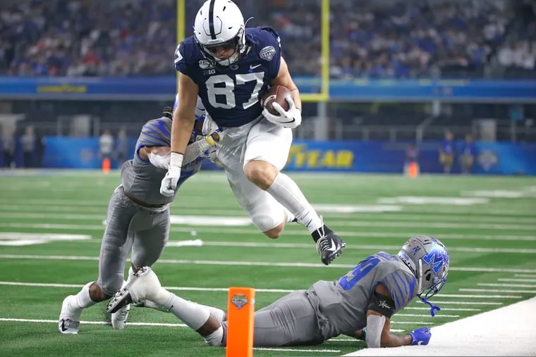 Penn State tight end Pat Freiermuth, here leaping over two Memphis defensive backs in last December's Cotton Bowl, says he is confident that the Nittany Lions will continue to make sacrifices to stay safe in their hopes of playing a full 2020 season.