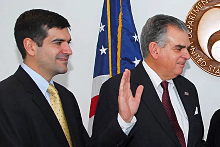 Sam LaHood with his father, Ray. The younger LaHood is among 16 Americans Cairo charged for pro-democracy work. (Transportation Department, File)