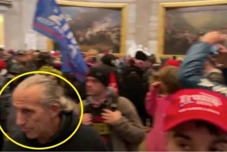 Surveillance footage shows a man prosecutors have identified as Jim Robinson, of Schwenksville, inside the Capitol Rotunda during the Jan. 6, 2021 riot.