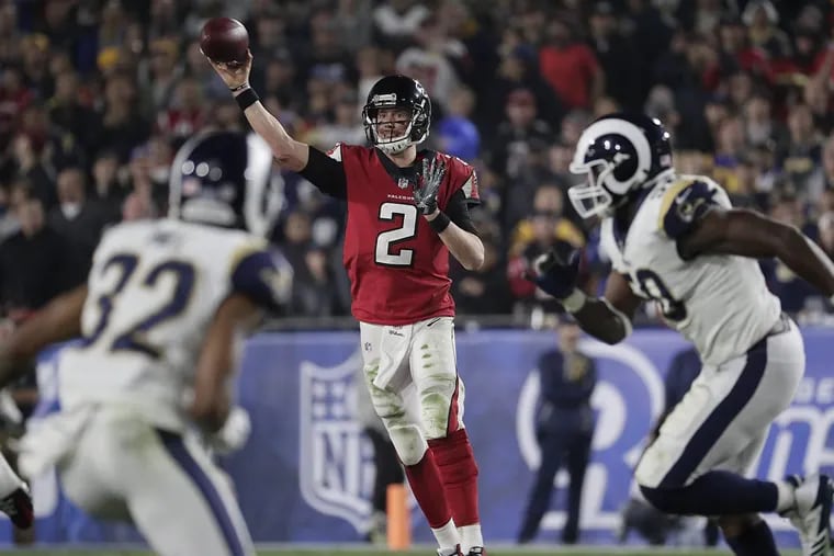 Atlanta Falcons quarterback Matt Ryan passing on the run against the Rams on Saturday.