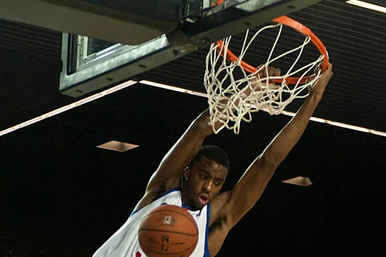 Hollis Thompson dunks during NBA preseason action. (Alvaro Barrientos/AP)