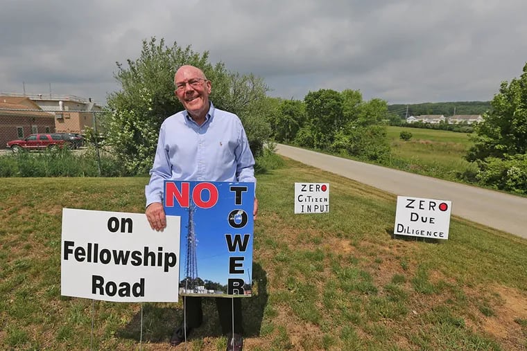 Raymond Erfle near the site of the planned radio tower, which opponents say will lower home prices. (DAVID SWANSON / Staff Photographer)