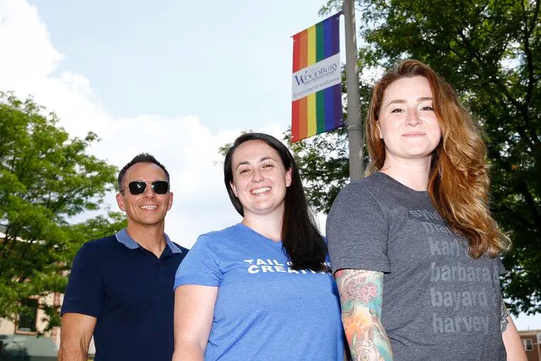 Woodbury Community Pride President Tony Doran (left) with Tail of Two Creatives, a digital marketing company, owners Shea Kucenski (center) and Danielle Roberts in downtown Woodbury, New Jersey on Friday, June 28, 2019.  The business received a $2K grant from Woodbury Community Pride, a three-year-old organization that promotes the city as an LGBTQ friendly place and has secured city council approval for several policies aimed at protecting the community's rights.